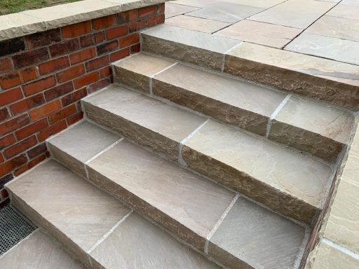 Solid sandstone steps, reclaimed brick and stone copings