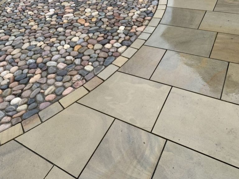 Yorkstone and traditional cobble paving near Calderstones